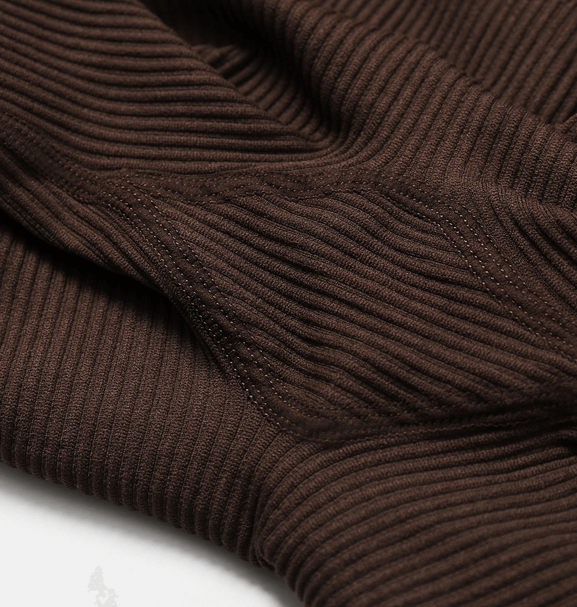 Close-up of brown seamless yoga suit fabric showcasing its ribbed texture and durability for stylish women’s fitness attire.